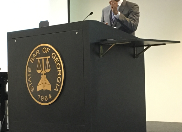 Dr. Snehal Dalal speaking at podium
