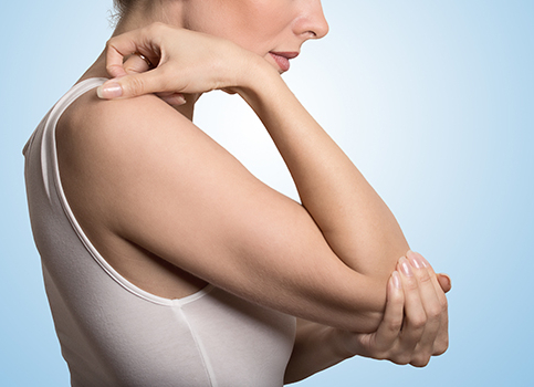 Woman Holds Elbow