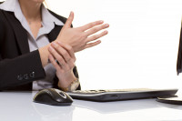 Business woman with wrist pain