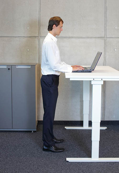 Working at standing desk Working at standing desk