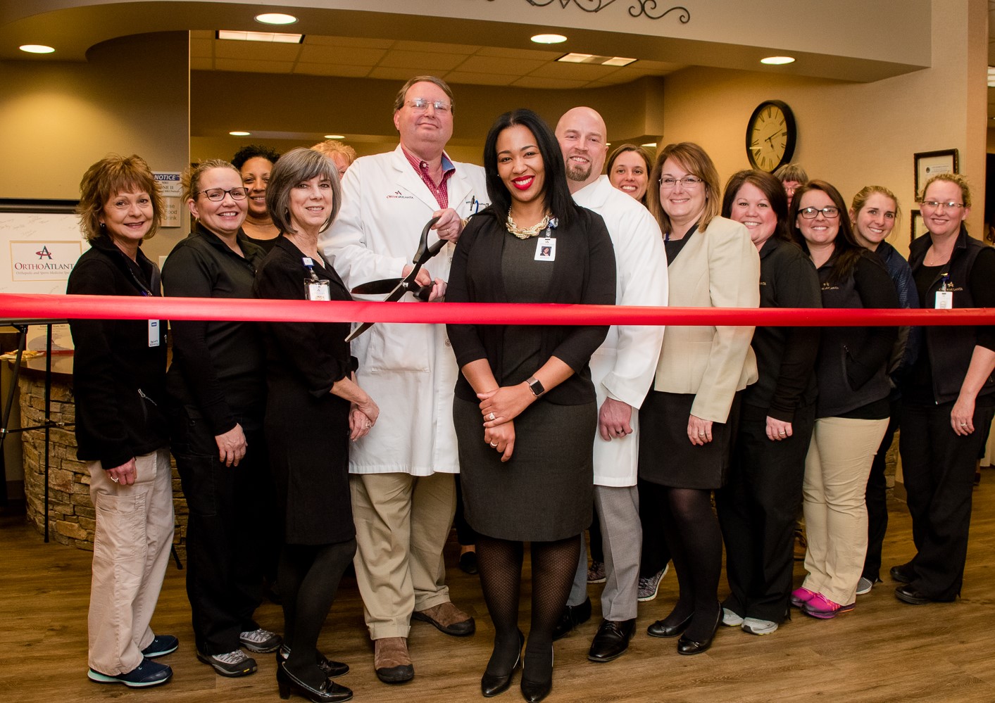 OrthoAtlanta physicians, Dr. Matthew Jaffe, Dr. Yolanda Scott and Dr. Christopher Burket and staff ribbon-cutting commemorates the remodel of the OrthoAtlanta Douglasville office.