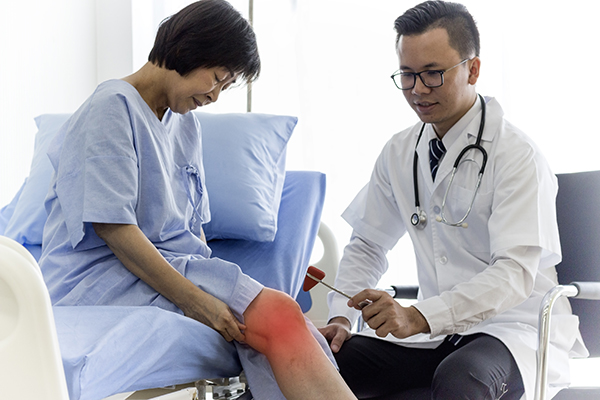 Doctor Discusses Knee with Patient