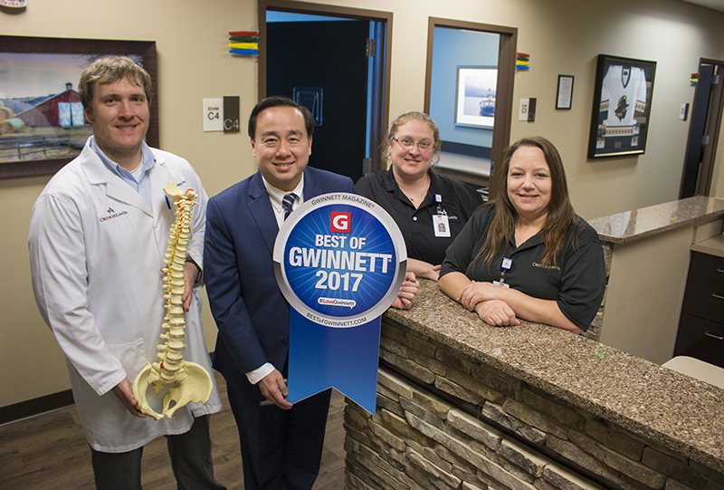 OrthoAtlanta orthopedic spine surgeon, Tuan L. Bui, M.D. and staff